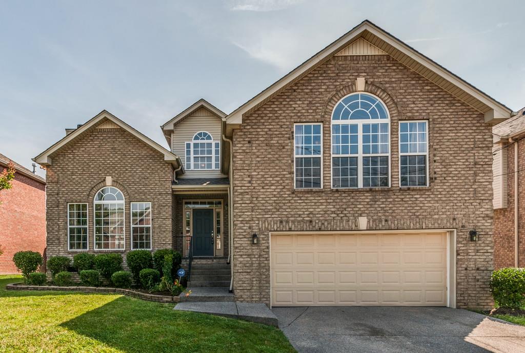 7060 Red Apple Road Antioch, TN 37013 - Photo 1 of 1 a front view of a house with a yard