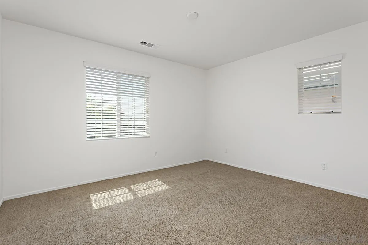258 Windsor Grey Way Fallbrook, CA 92028 - Photo 23 of 44 an empty room with a window
