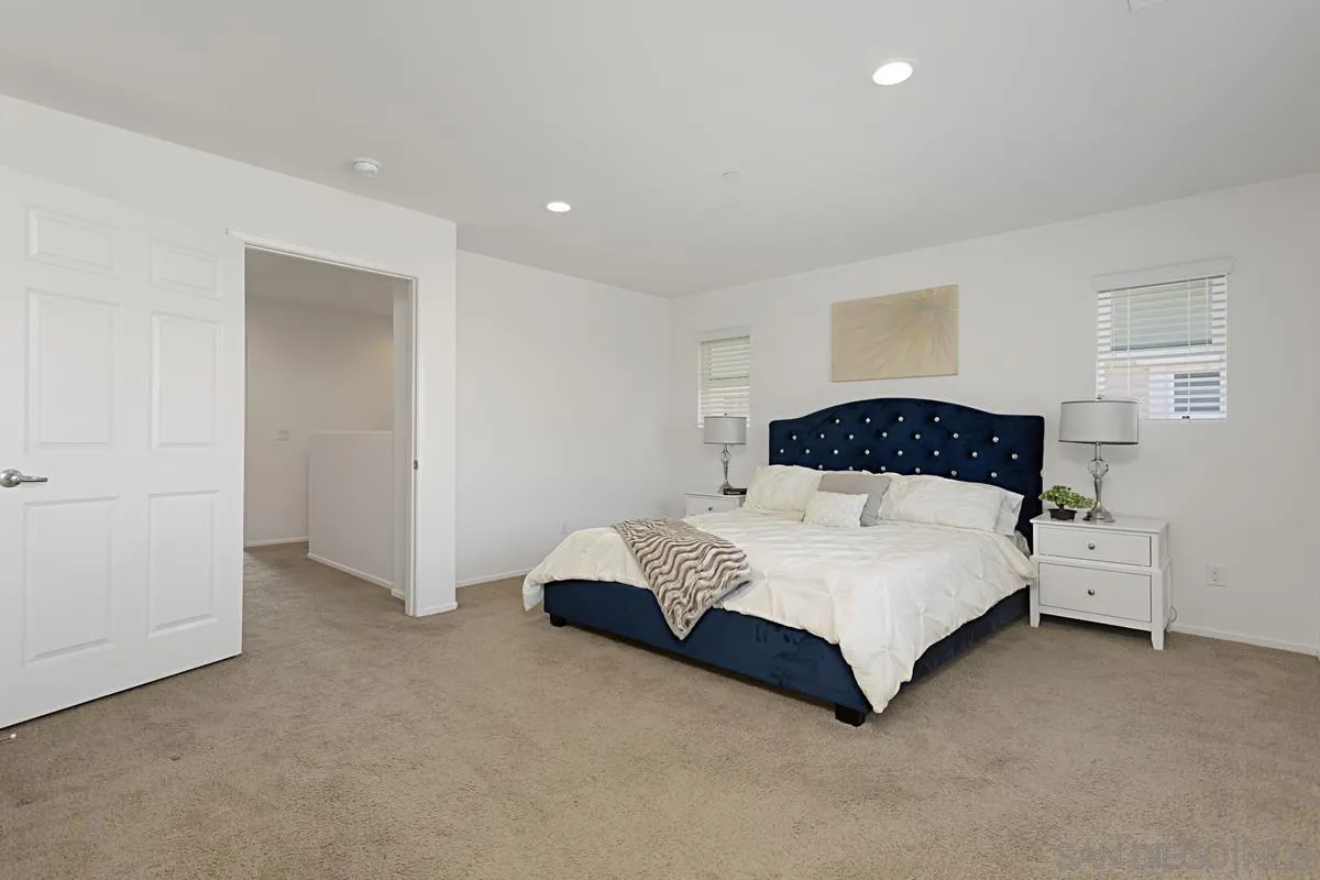 258 Windsor Grey Way Fallbrook, CA 92028 - Photo 24 of 44 a bedroom with a bed and a cabinets