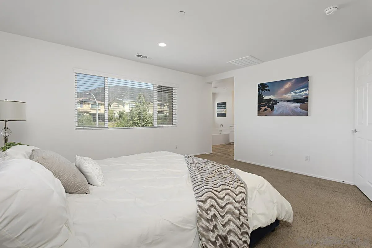 258 Windsor Grey Way Fallbrook, CA 92028 - Photo 26 of 44 a bedroom with a bed and a window
