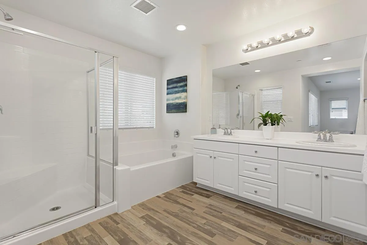 258 Windsor Grey Way Fallbrook, CA 92028 - Photo 27 of 44 a spacious bathroom with a tub sink shower and mirror