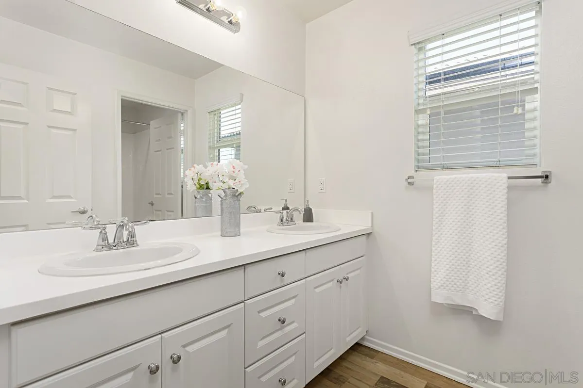 258 Windsor Grey Way Fallbrook, CA 92028 - Photo 32 of 44 a bathroom with a sink and a mirror