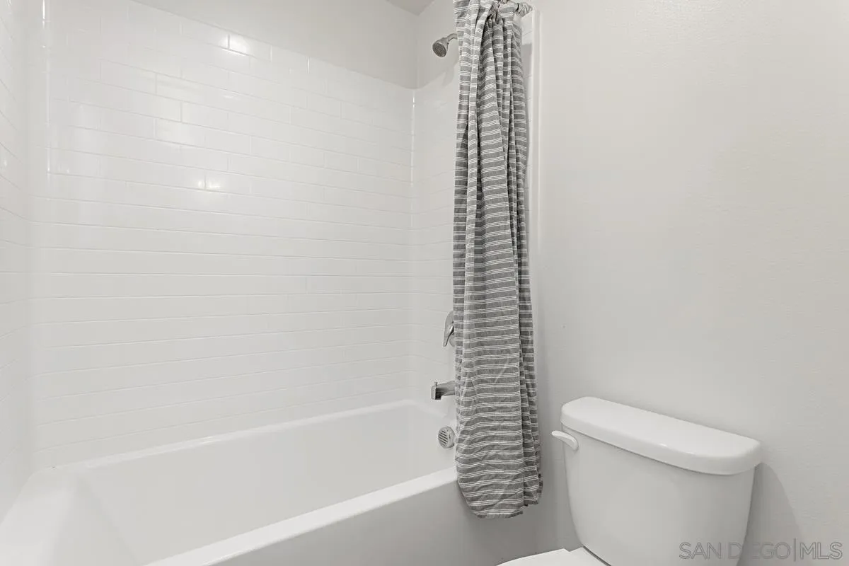 258 Windsor Grey Way Fallbrook, CA 92028 - Photo 33 of 44 a bath room with a toilet and a shower