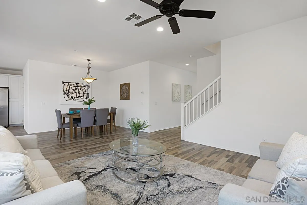 258 Windsor Grey Way Fallbrook, CA 92028 - Photo 7 of 44 a living room with furniture and a chandelier