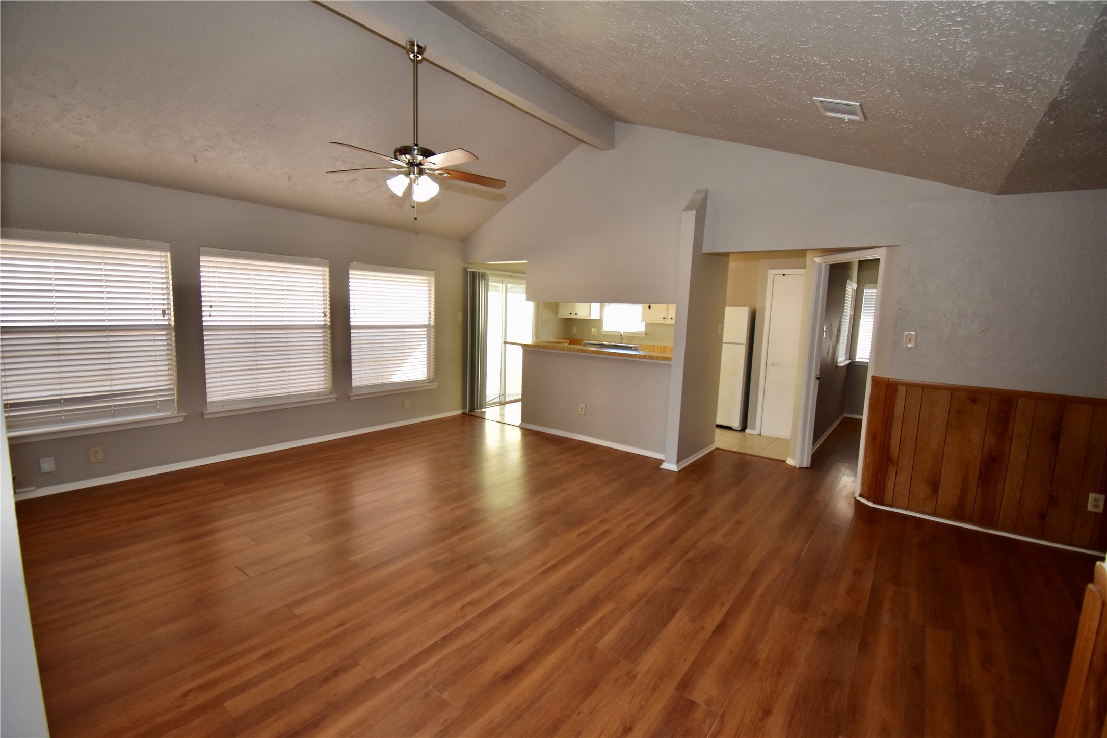 9231 Goodmeadow Drive Houston, TX 77064 - Photo 5 of 26 wooden floor in an empty room with a window