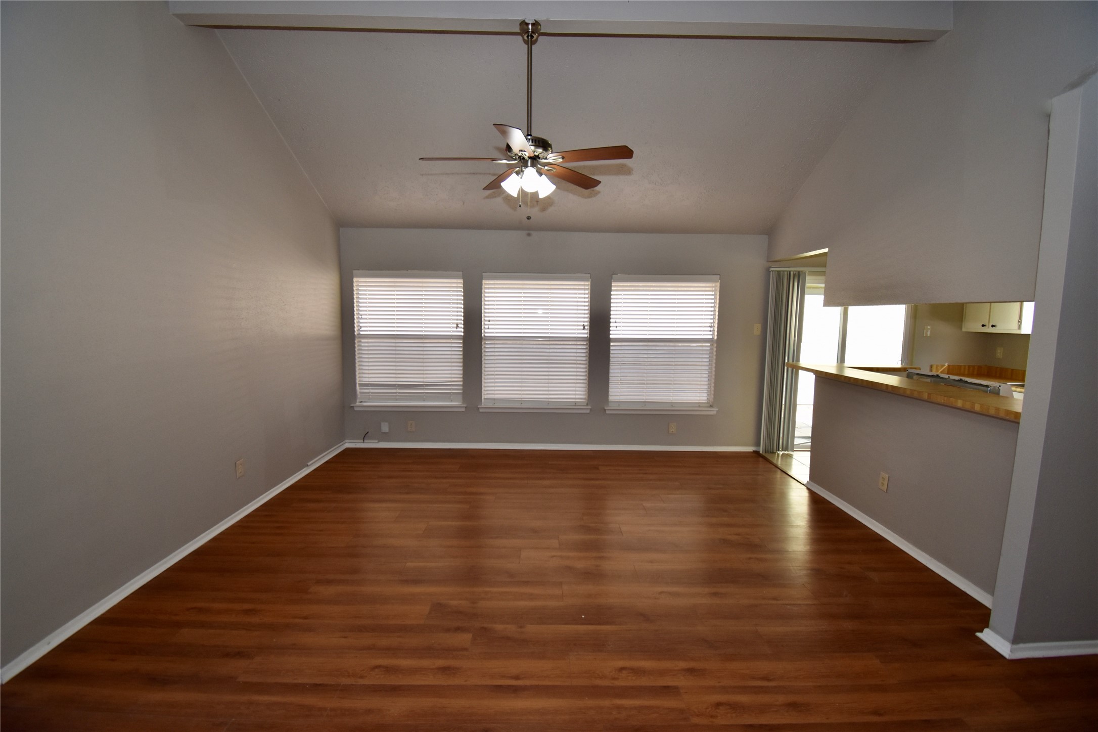 9231 Goodmeadow Drive Houston, TX 77064 - Photo 8 of 26 a view of an empty room with wooden floor and a window