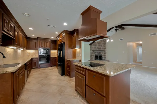 a kitchen with a stove and a refrigerator