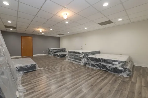 a room with furniture and a wooden floor