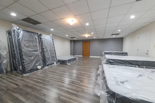 a view of a room with wooden floor