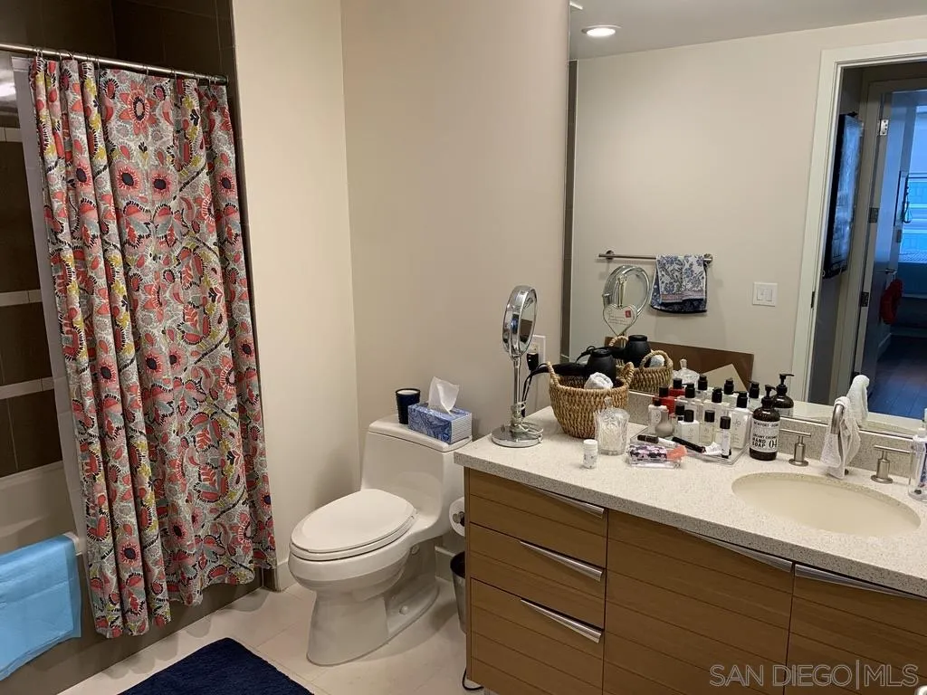 1325 Pacific Highway, Unit 1703 San Diego, CA 92101 - Photo 15 of 18 a bathroom with a sink and a mirror