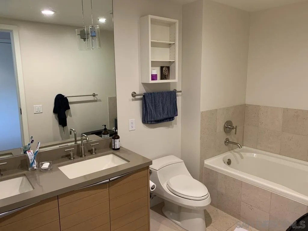1325 Pacific Highway, Unit 1703 San Diego, CA 92101 - Photo 16 of 18 a bathroom with a sink a toilet and shower