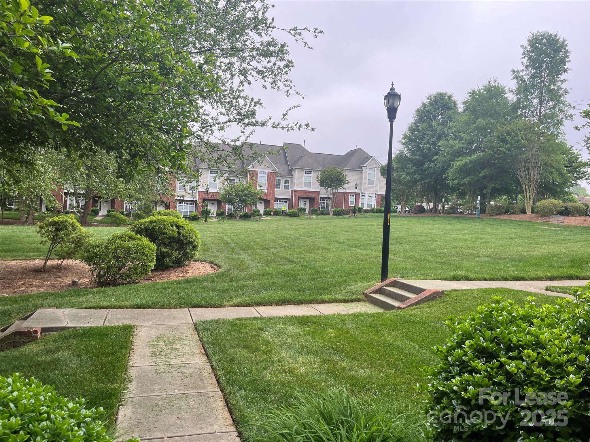 1131 Central Park Circle Davidson, NC 28036 - Photo 2 of 21 a view of a park with large trees