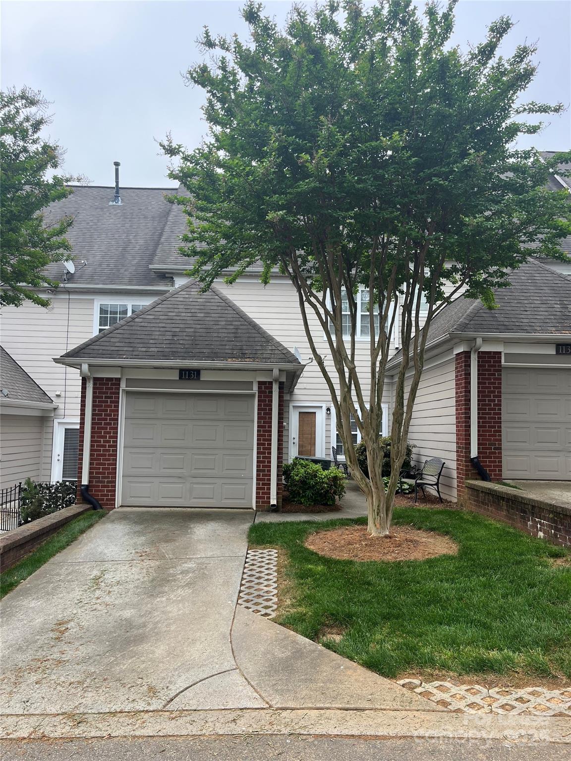 1131 Central Park Circle Davidson, NC 28036 - Photo 3 of 21 a front view of a house with garden