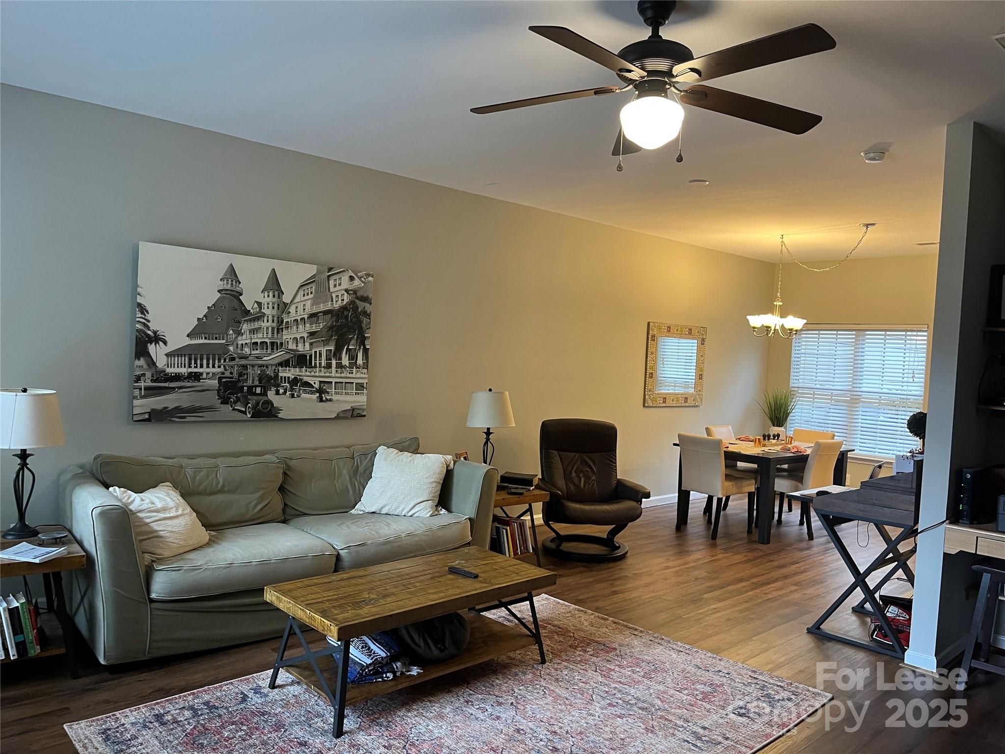 1131 Central Park Circle Davidson, NC 28036 - Photo 5 of 21 a living room with furniture and wooden floor