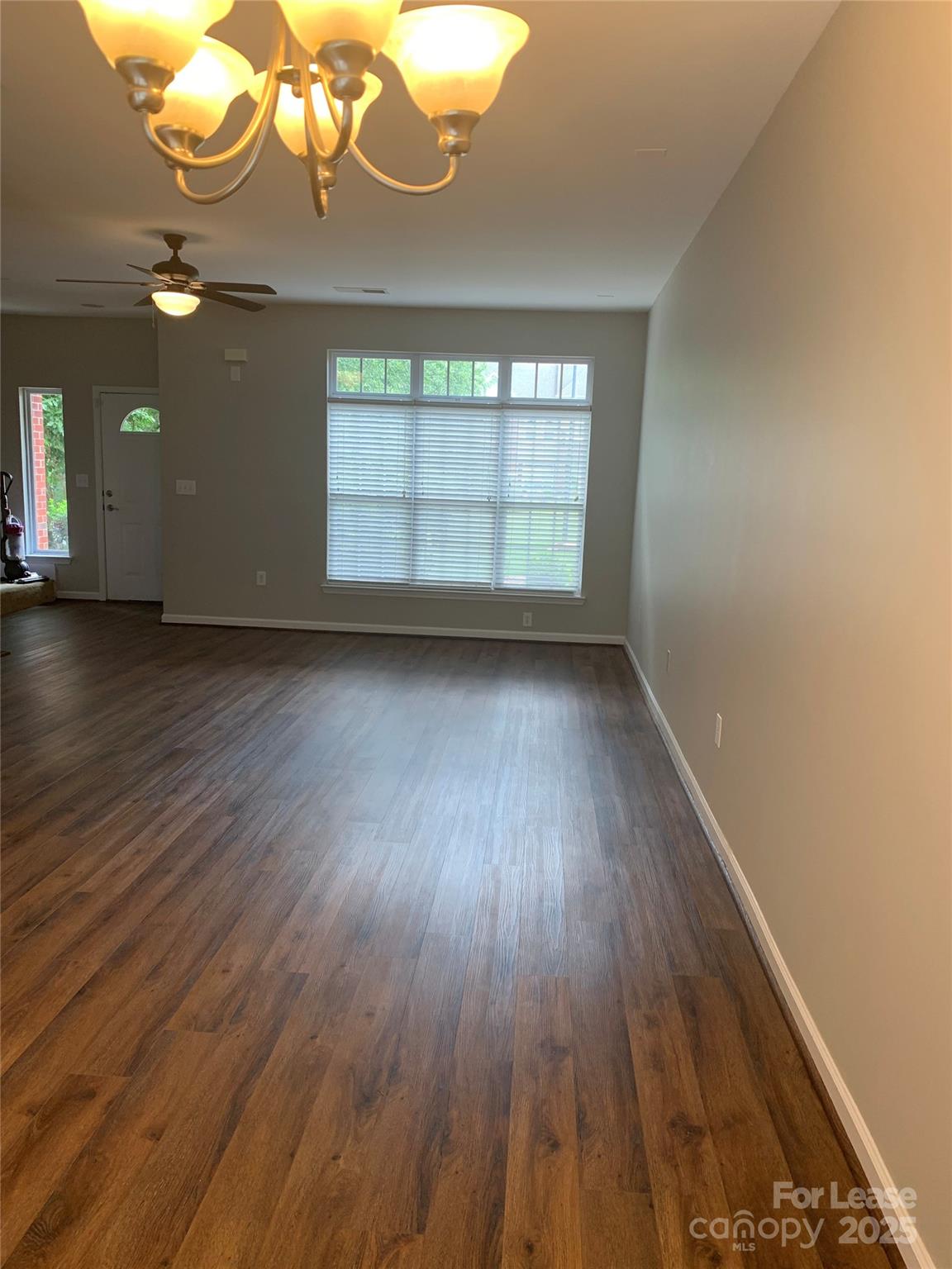 1131 Central Park Circle Davidson, NC 28036 - Photo 9 of 21 wooden floor in an empty room with a window
