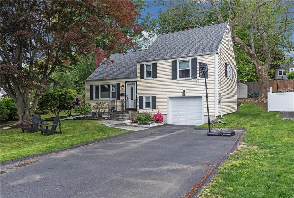 143 Alton Road Stamford, CT 06906 - Photo 1 of 1 a front view of a house with a yard and garage