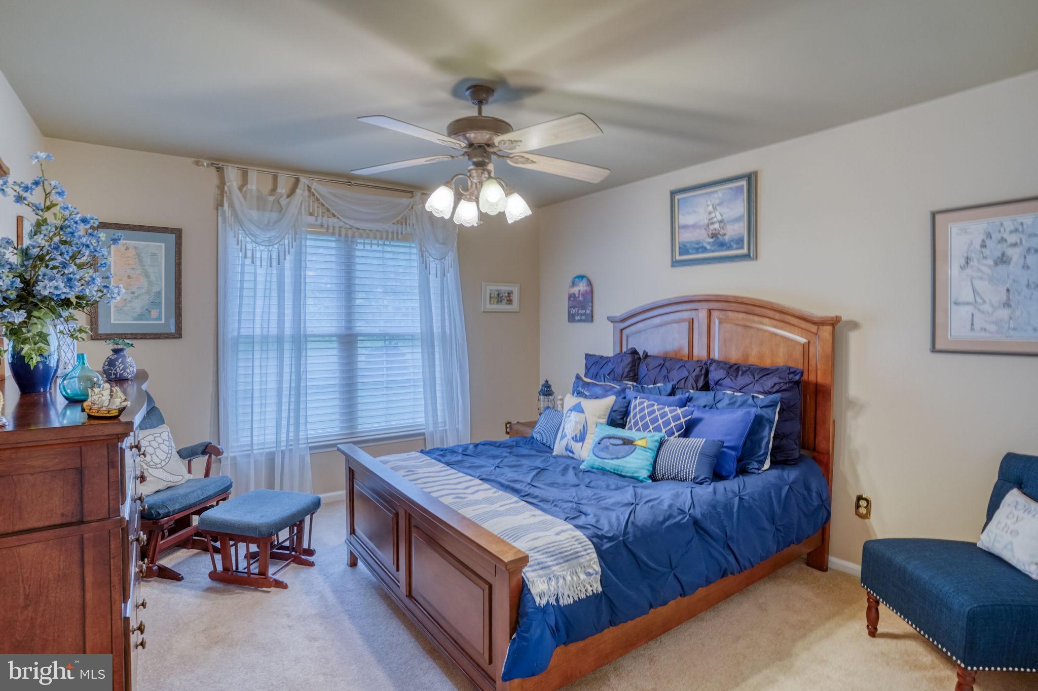 357 Willits Way Garnet Valley, PA 19060 - Photo 44 of 63 a bedroom with a bed and a chandelier