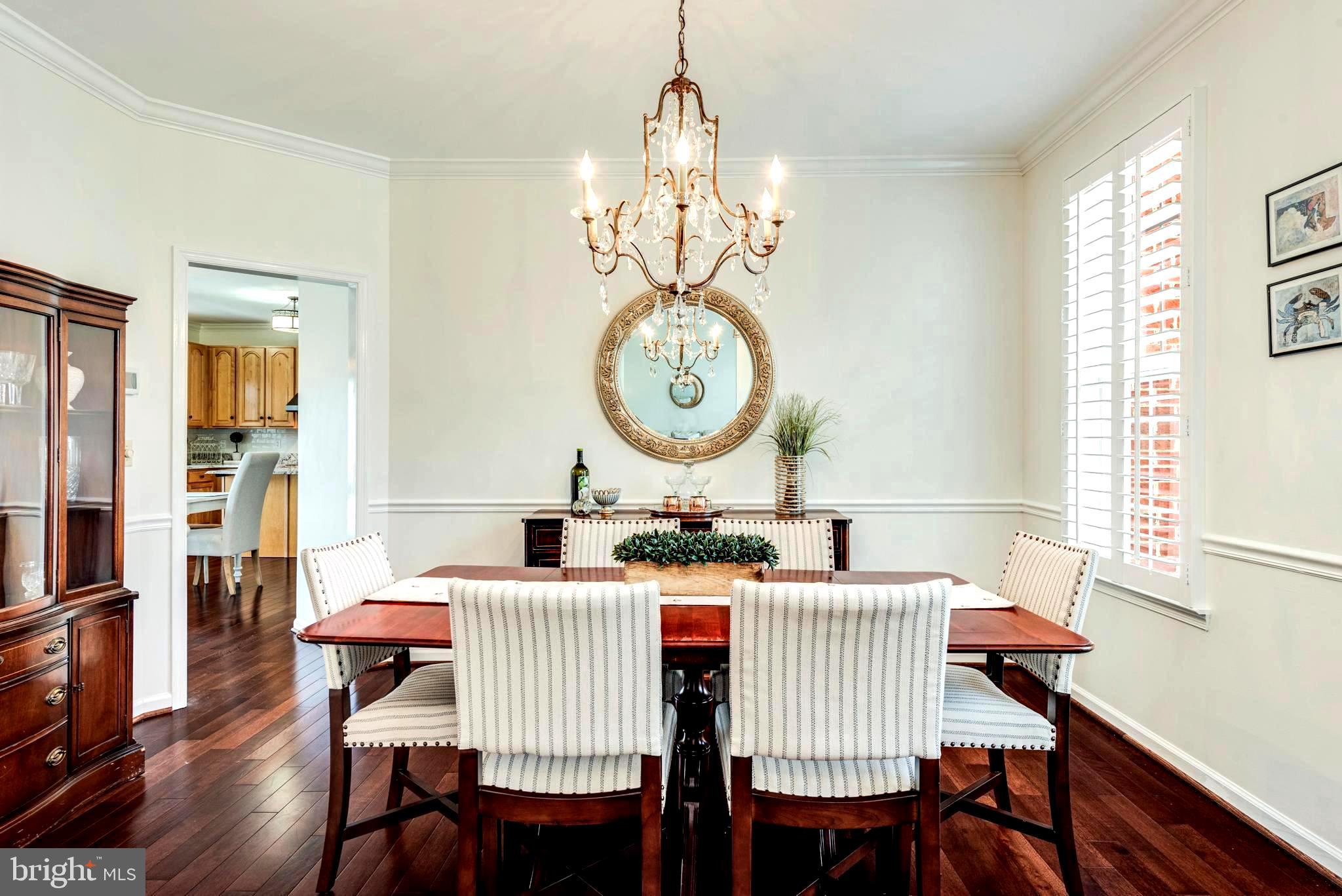 1566 Comanche Road Arnold, MD 21012 - Photo 14 of 51 Chandeliered Dining Room with Chair Rail Accent