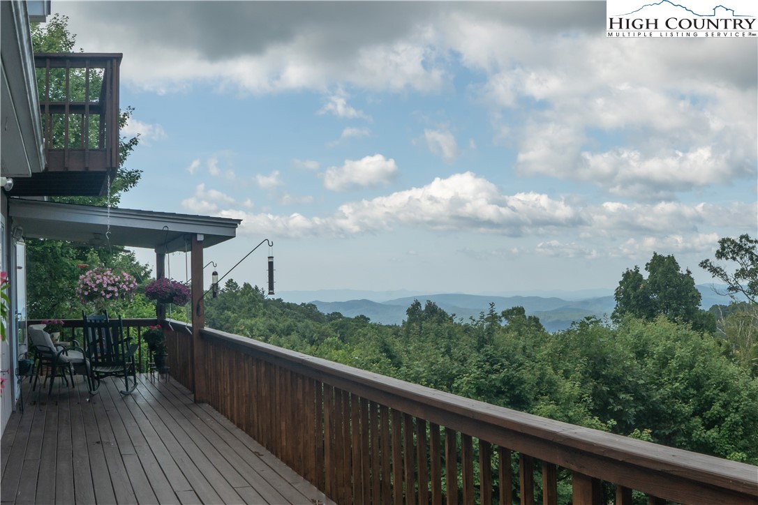320 Misty Ridge Lane Blowing Rock, NC 28605 - Photo 13 of 46 a view of a balcony with wooden floor and fence