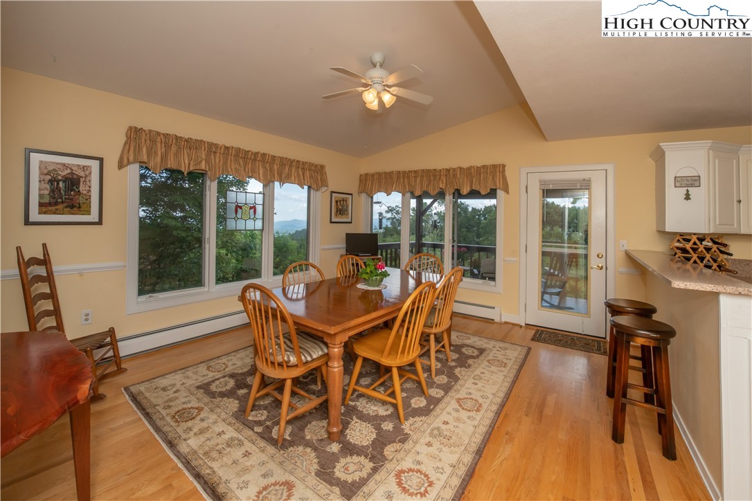 320 Misty Ridge Lane Blowing Rock, NC 28605 - Photo 16 of 46 a dining room with furniture window and wooden floor