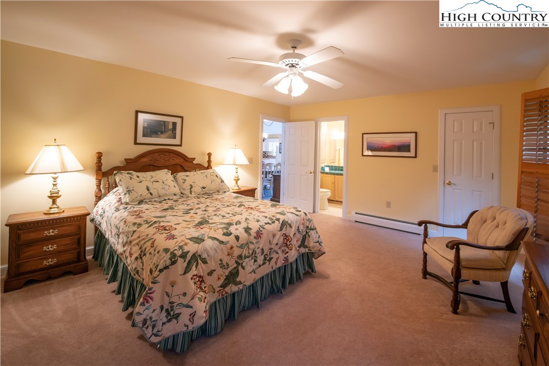 320 Misty Ridge Lane Blowing Rock, NC 28605 - Photo 18 of 46 a bedroom with a bed and chair