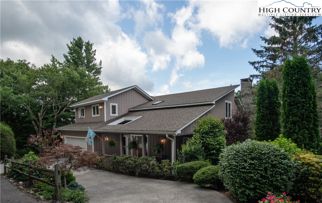 320 Misty Ridge Lane Blowing Rock, NC 28605 - Photo 2 of 46 a front view of a house with garden