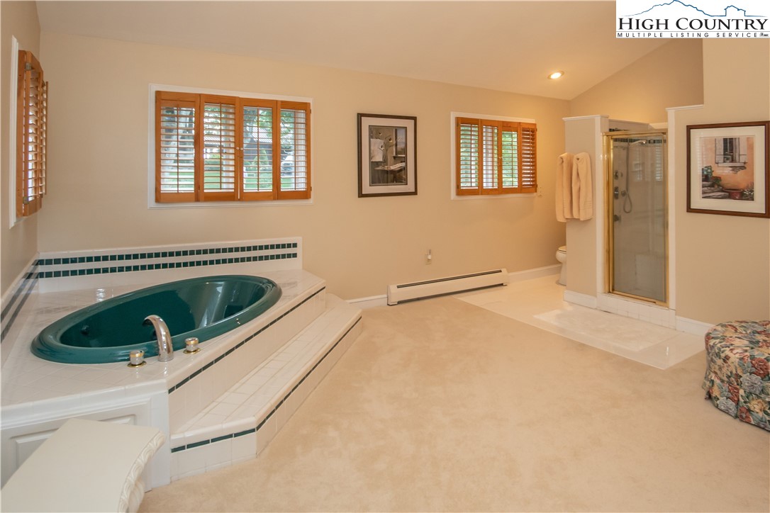 320 Misty Ridge Lane Blowing Rock, NC 28605 - Photo 29 of 46 a view of a bedroom with a bed and a window