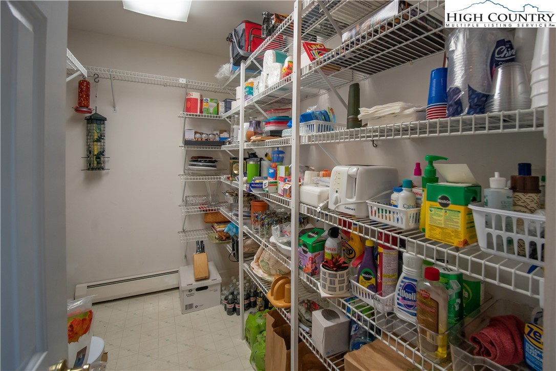 320 Misty Ridge Lane Blowing Rock, NC 28605 - Photo 34 of 46 a room with lots of different colored cloths