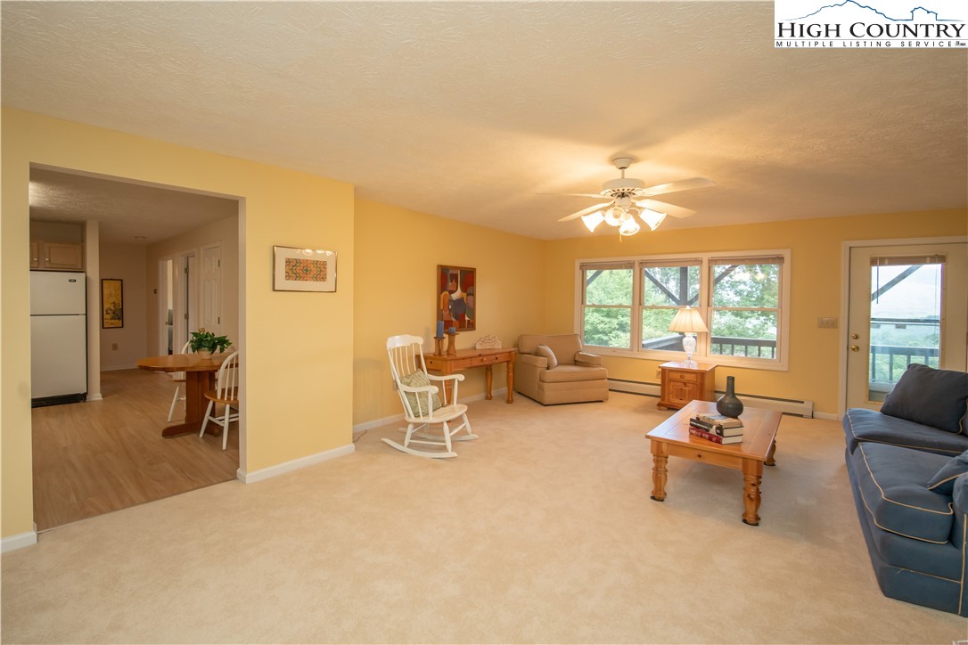 320 Misty Ridge Lane Blowing Rock, NC 28605 - Photo 36 of 46 a living room with furniture and a large window
