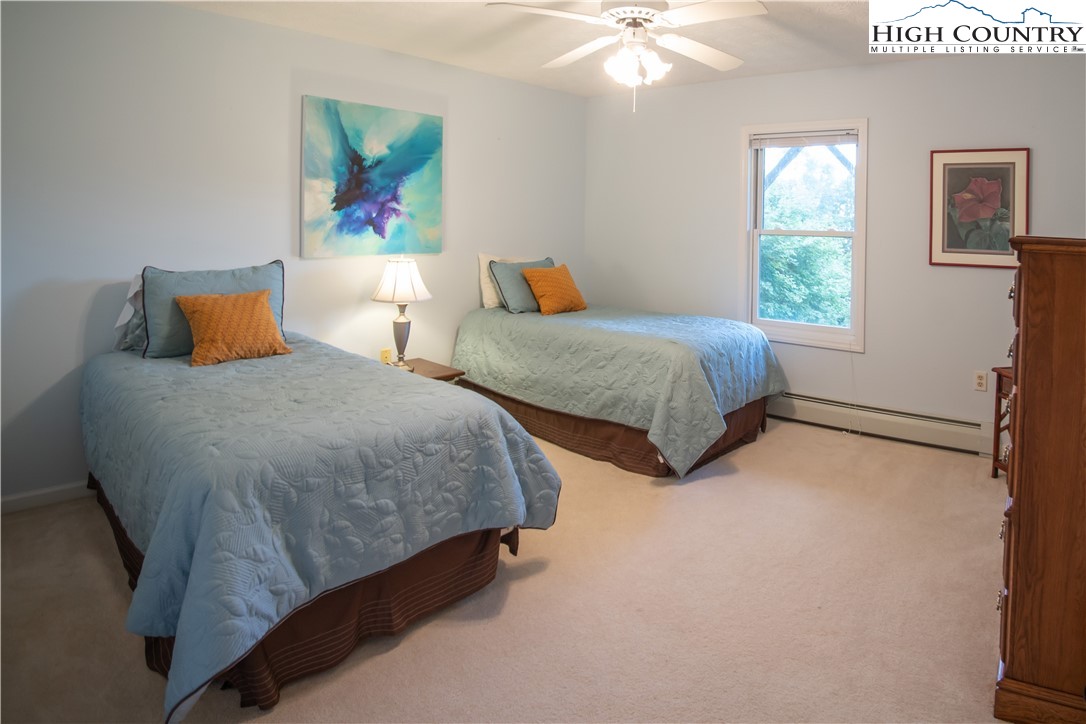 320 Misty Ridge Lane Blowing Rock, NC 28605 - Photo 39 of 46 a bedroom with two beds and a window
