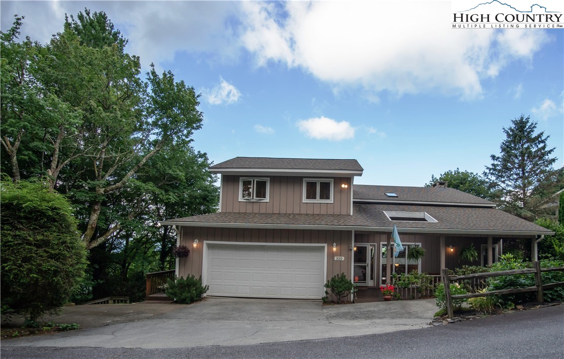 320 Misty Ridge Lane Blowing Rock, NC 28605 - Photo 45 of 46 a front view of a house with a garden