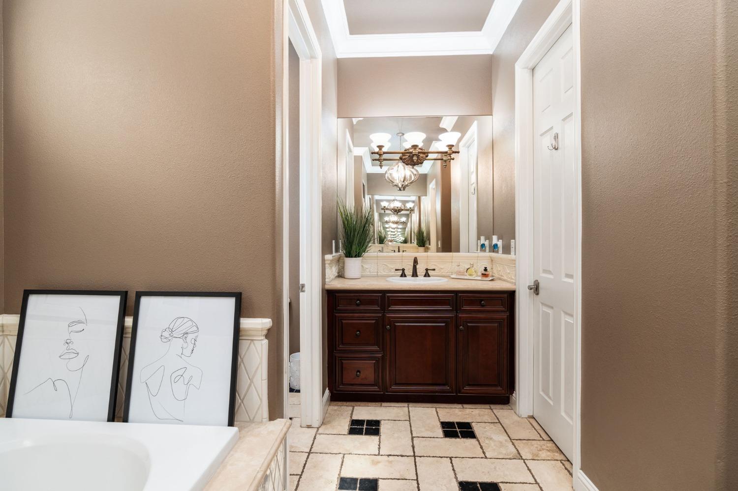 3545 Barclay Square Clovis, CA 93619 - Photo 21 of 31 a bathroom with a sink vanity and a mirror