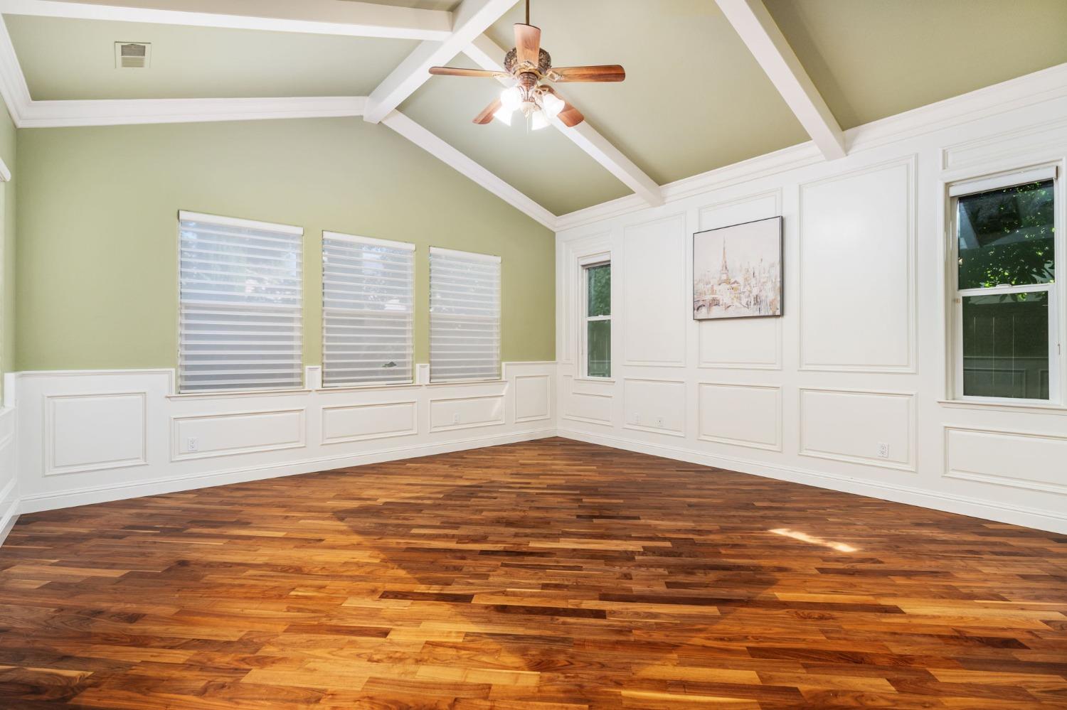3545 Barclay Square Clovis, CA 93619 - Photo 22 of 31 a view of an empty room with windows and chandelier fan
