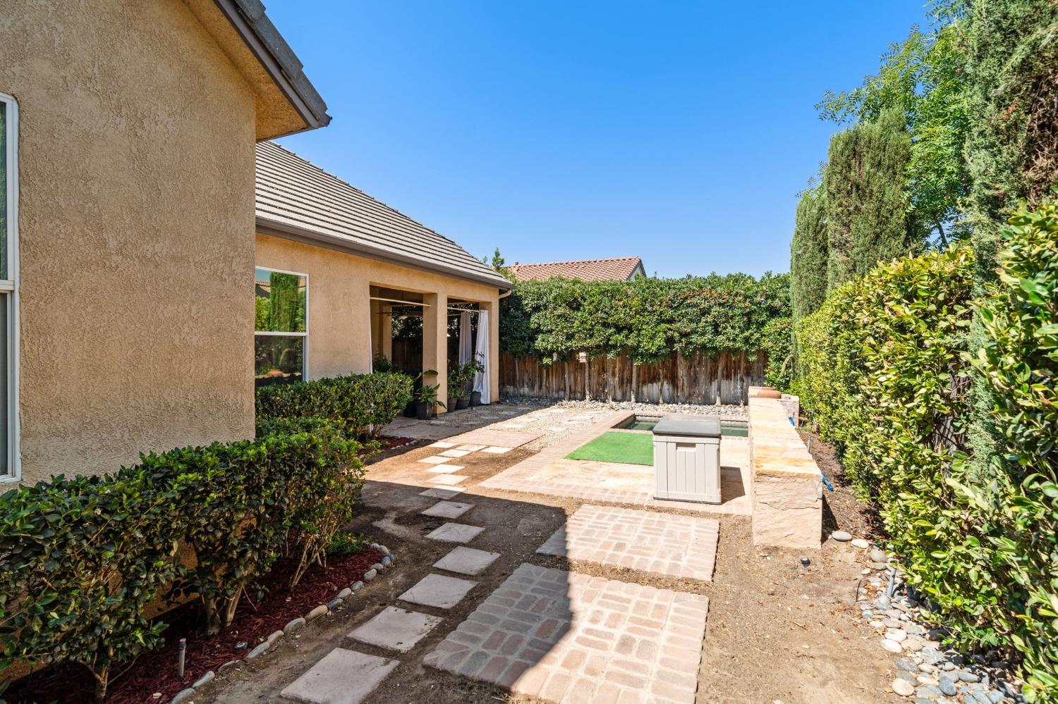 3545 Barclay Square Clovis, CA 93619 - Photo 29 of 31 a view of a backyard with swimming pool