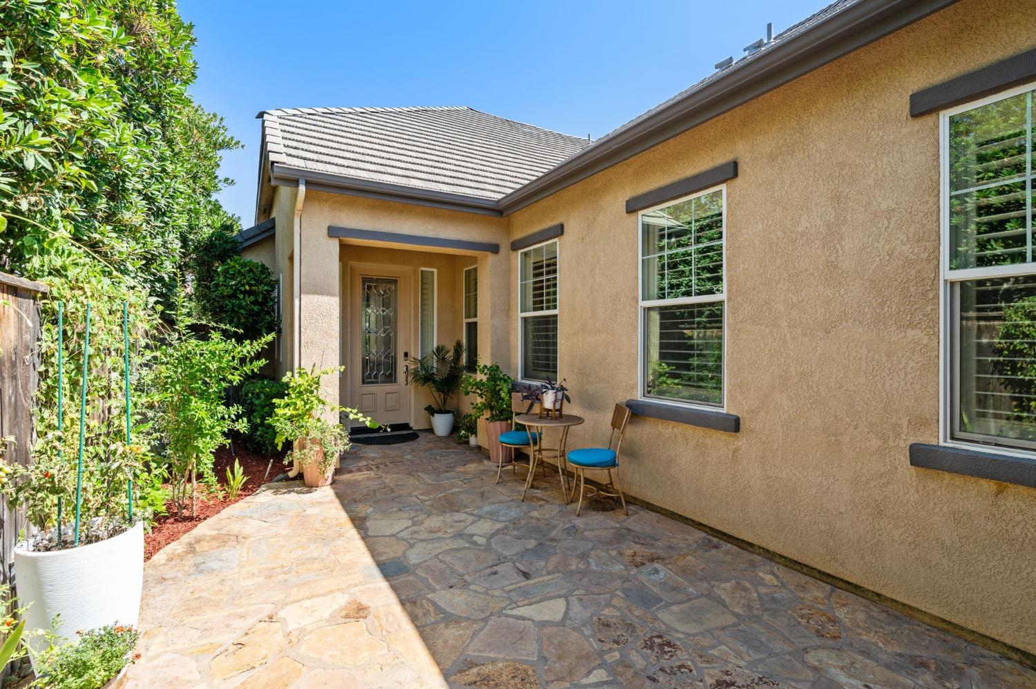 3545 Barclay Square Clovis, CA 93619 - Photo 3 of 31 a view of a house with sitting area and garden