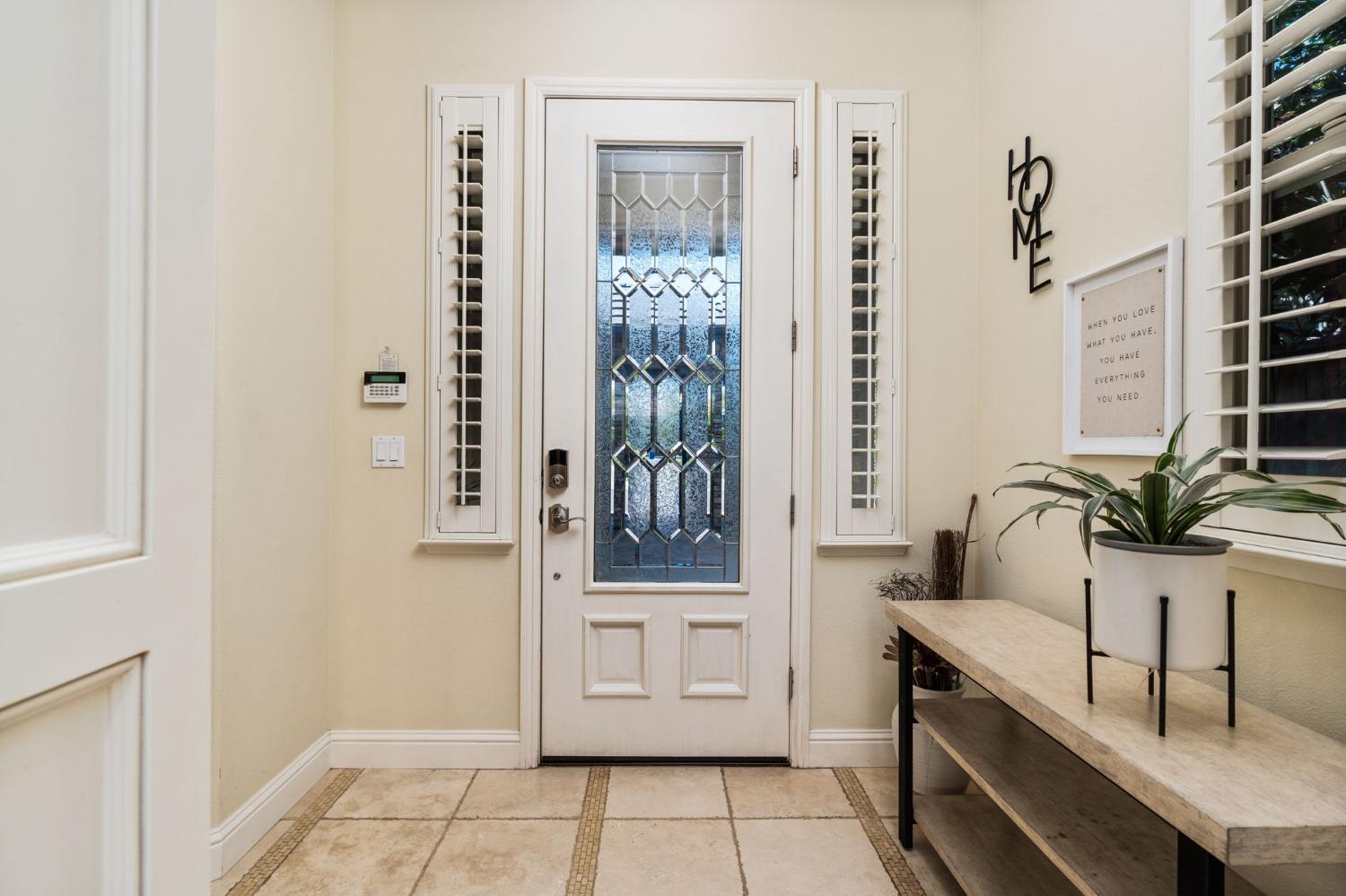 3545 Barclay Square Clovis, CA 93619 - Photo 4 of 31 a bathroom with a double vanity sink a toilet and a window