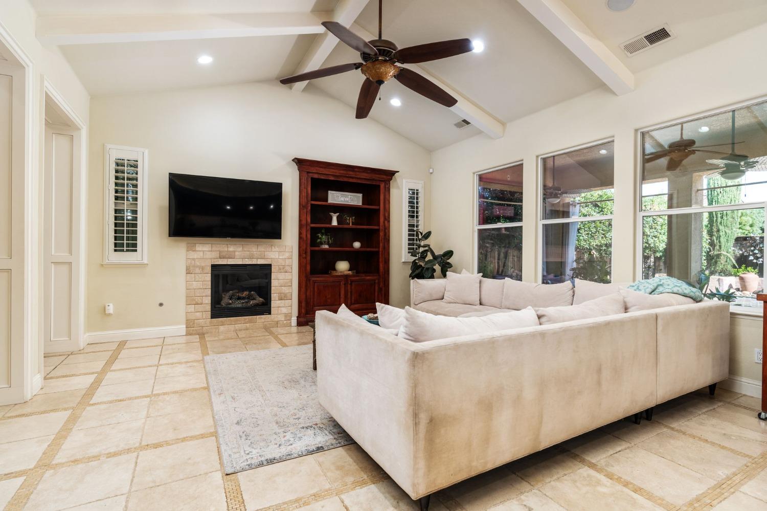 3545 Barclay Square Clovis, CA 93619 - Photo 7 of 31 a living room with fireplace furniture and a flat screen tv