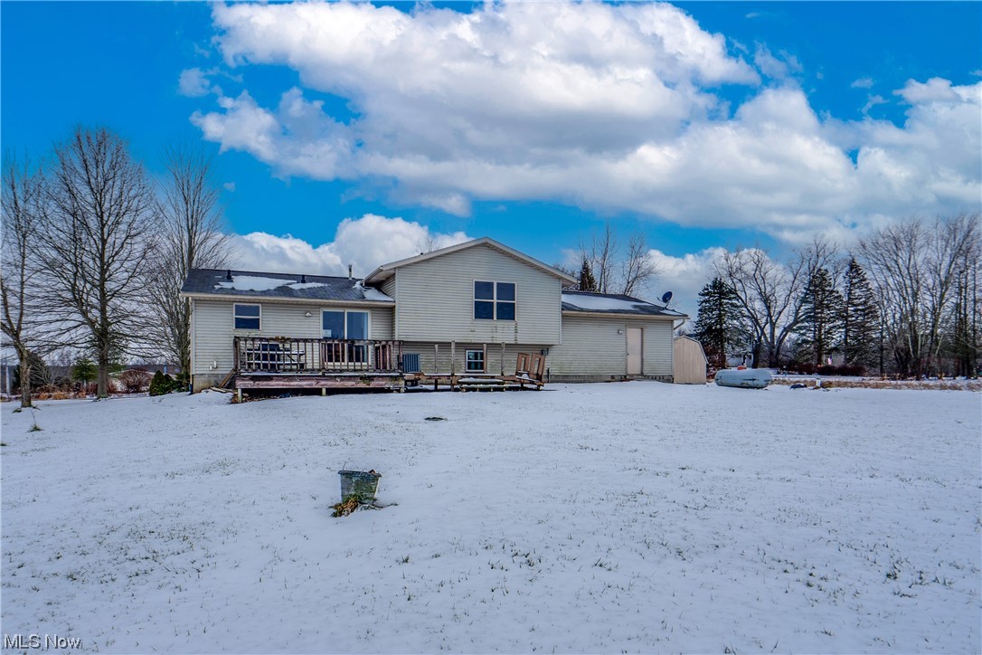 5303 Laubert Road Atwater, OH 44201 - Photo 6 of 37 Snow covered house with a deck and an outdoor structure