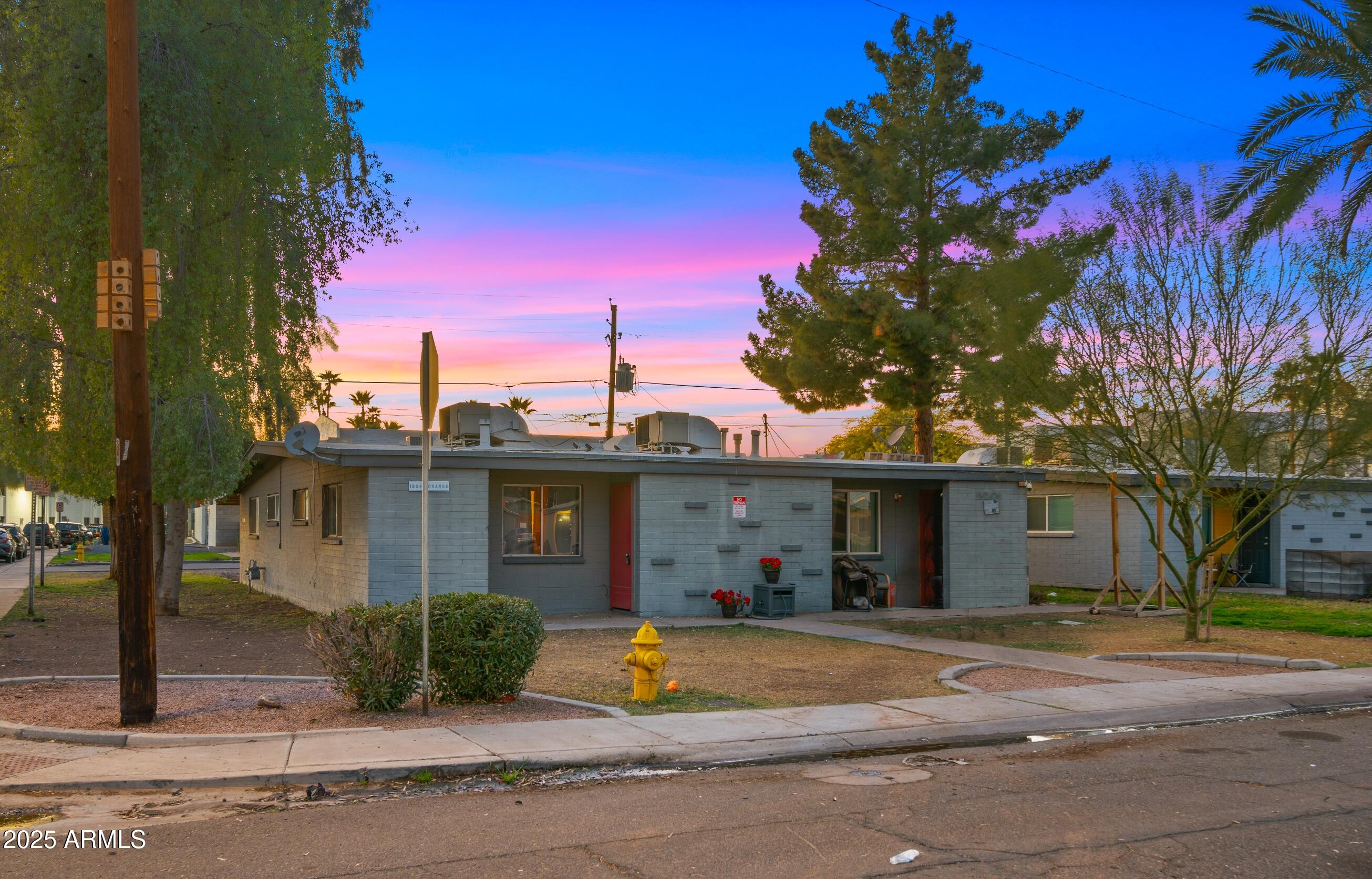908 South Mariana Street, Unit A Tempe, AZ 85281 - Photo 1 of 10 a front view of a house with a garden