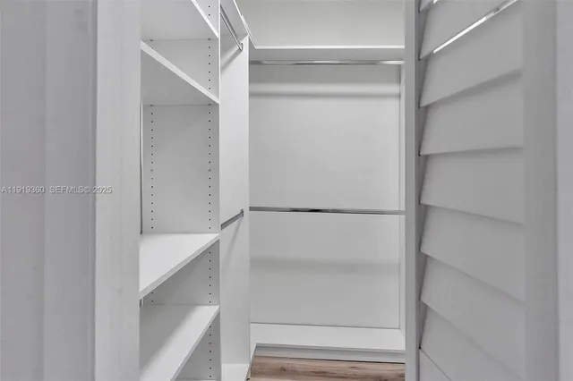 a view of an empty walk in closet