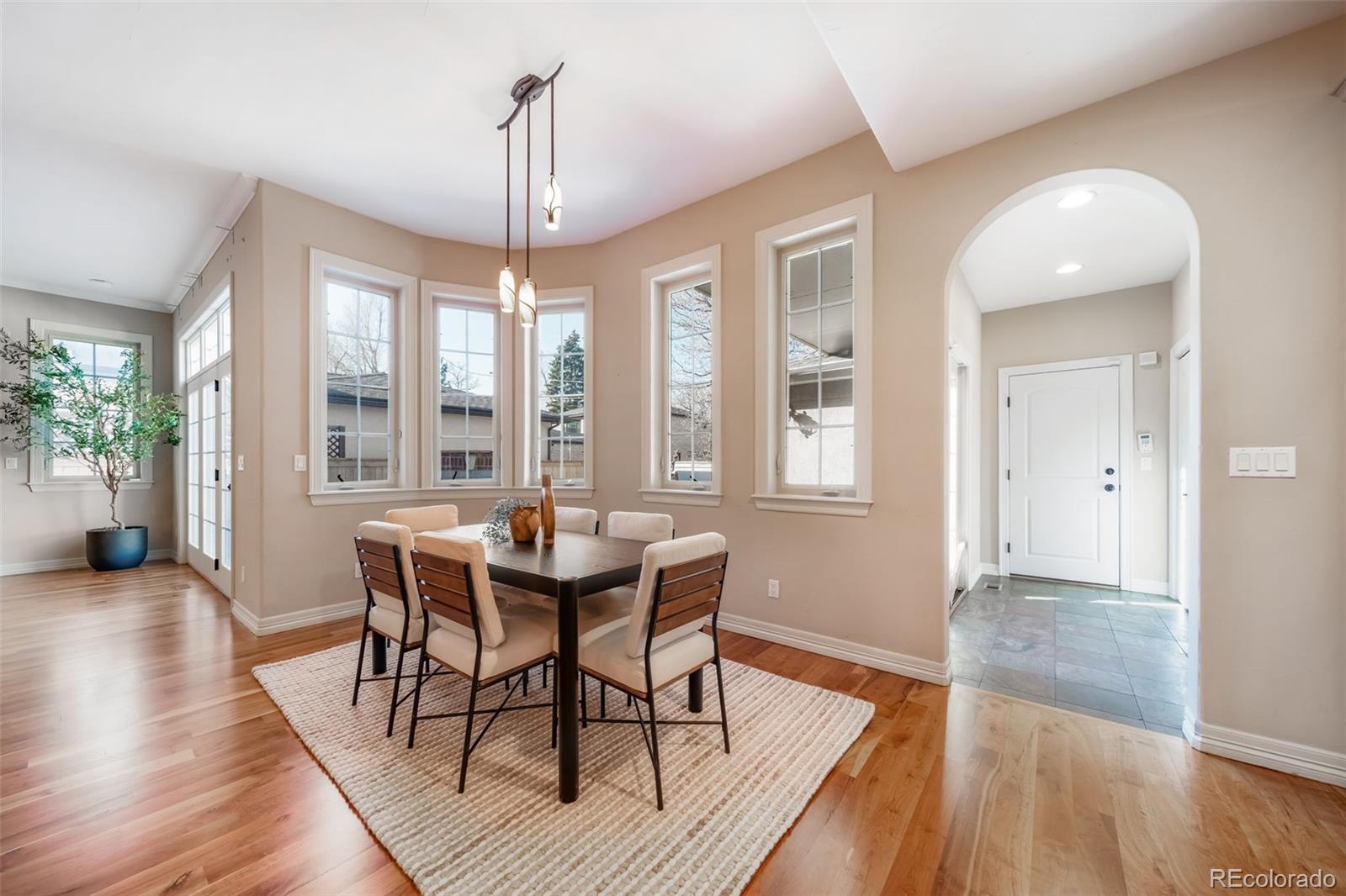 1425 South Elizabeth Street Denver, CO 80210 - Photo 12 of 50 a view of a dining room with furniture wooden floor and chandelier