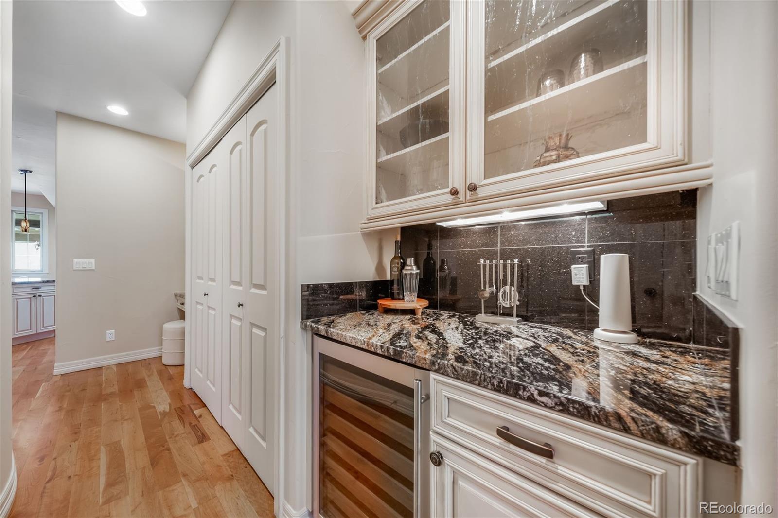 1425 South Elizabeth Street Denver, CO 80210 - Photo 15 of 50 a kitchen with stainless steel appliances granite countertop a stove and a granite counter tops