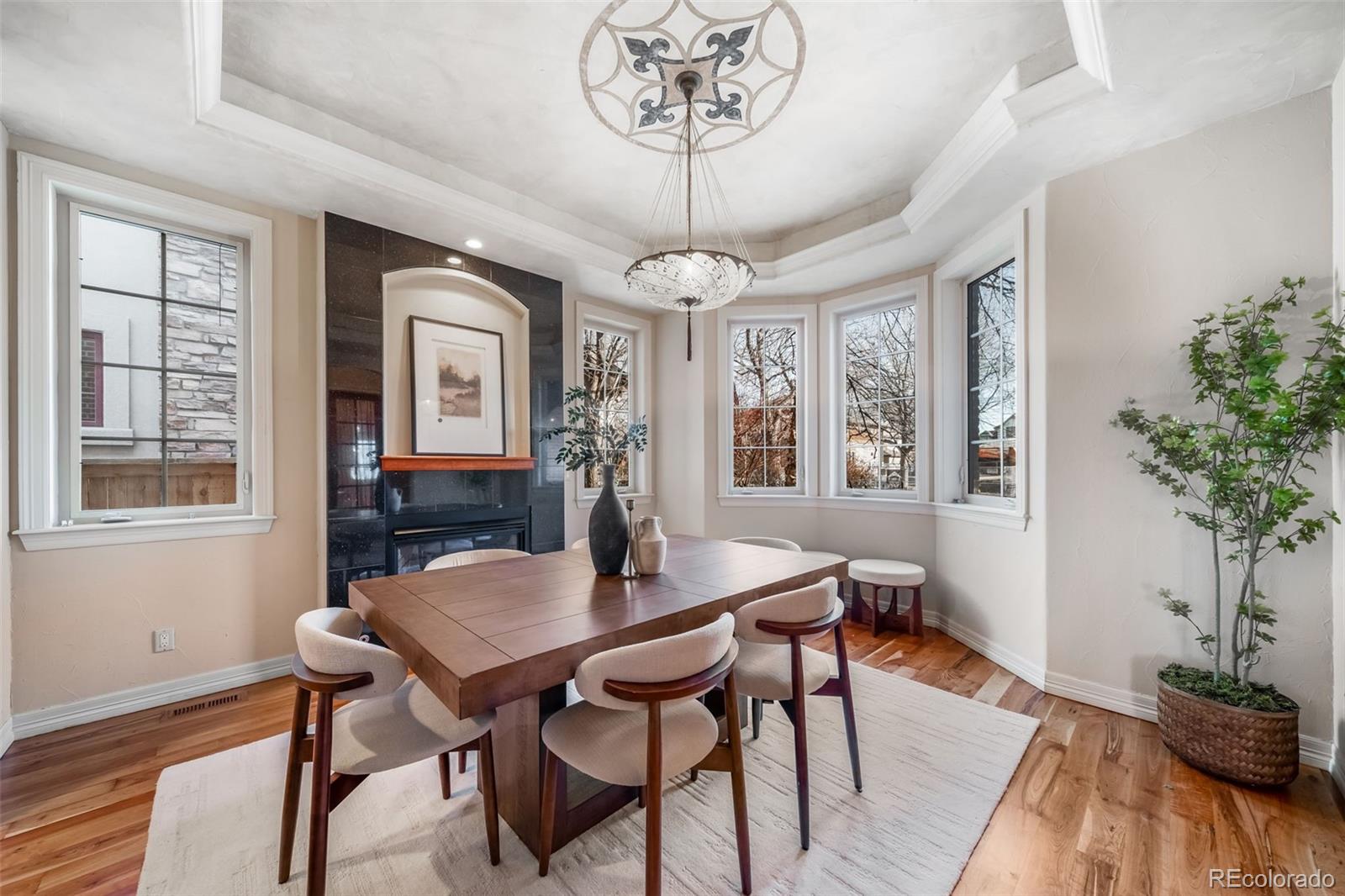 1425 South Elizabeth Street Denver, CO 80210 - Photo 16 of 50 a view of a dining room with furniture window and wooden floor