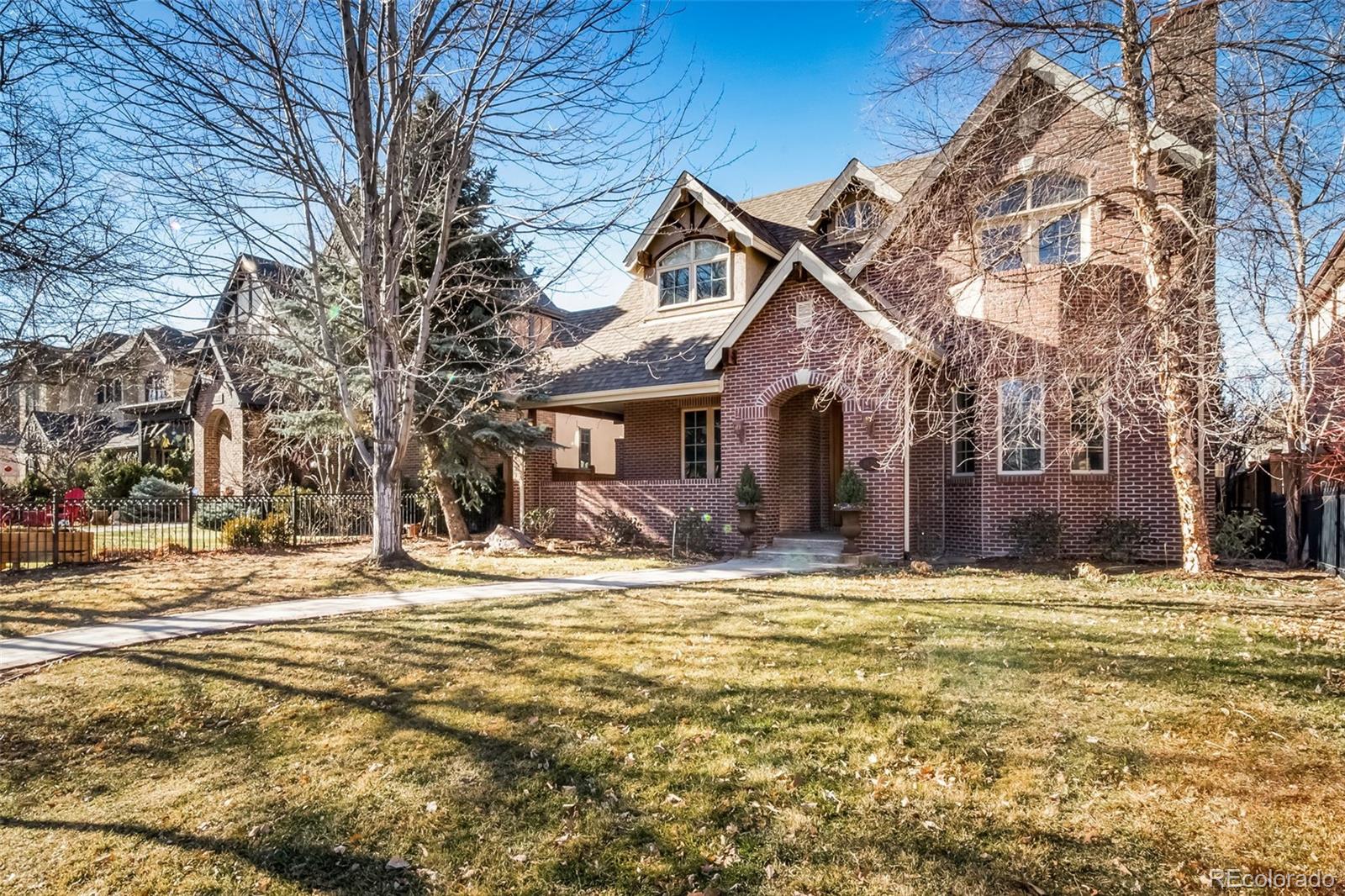 1425 South Elizabeth Street Denver, CO 80210 - Photo 2 of 50 a view of a house with a yard and covered with snow