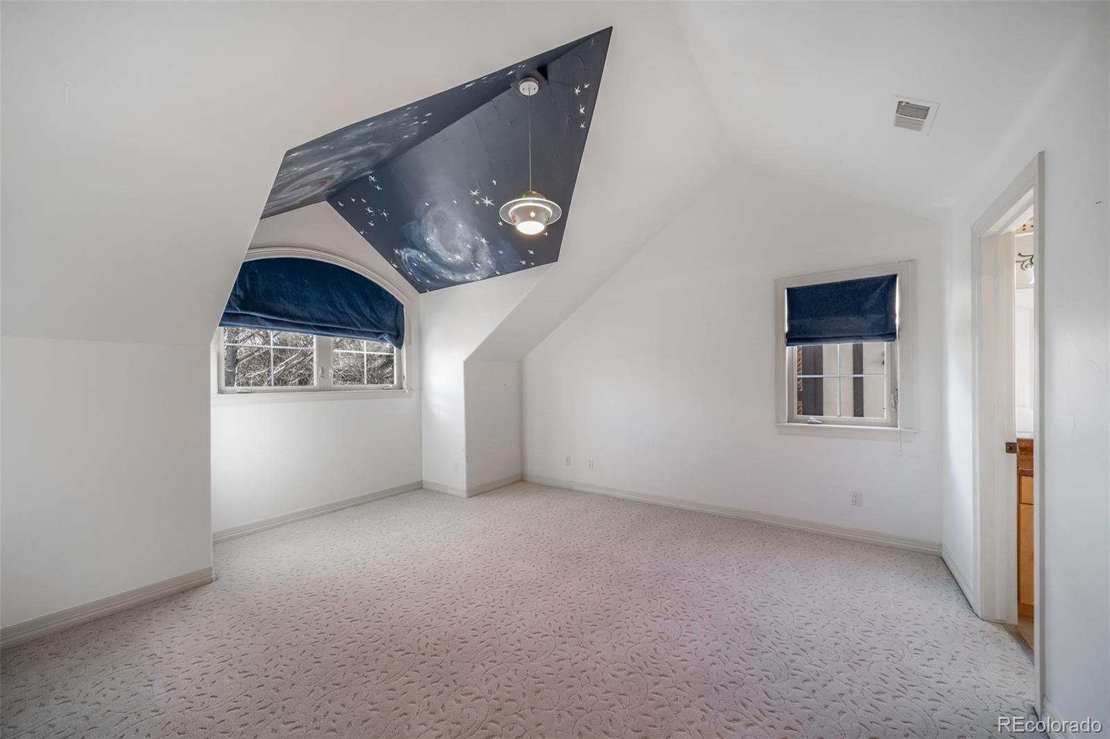 1425 South Elizabeth Street Denver, CO 80210 - Photo 24 of 50 an empty room with a fireplace and cabinet