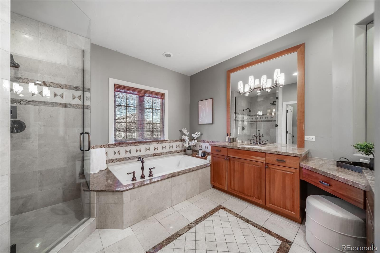 1425 South Elizabeth Street Denver, CO 80210 - Photo 28 of 50 a spacious bathroom with a tub sink and mirror