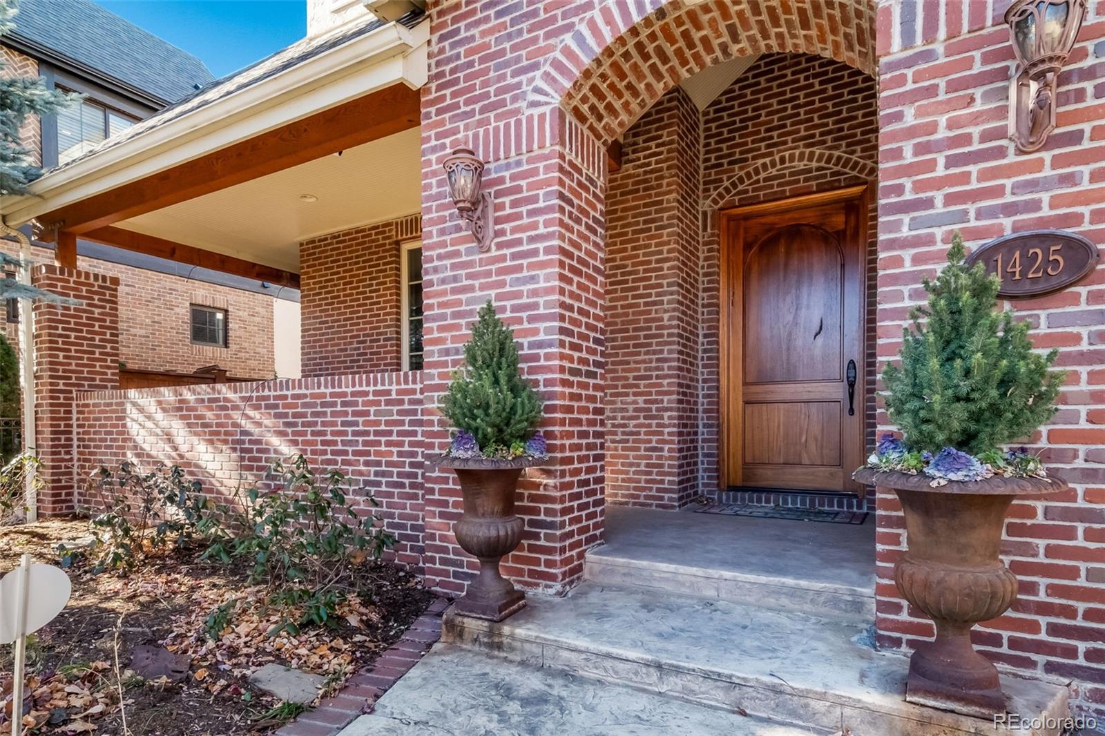1425 South Elizabeth Street Denver, CO 80210 - Photo 3 of 50 a front view of a house with a garden