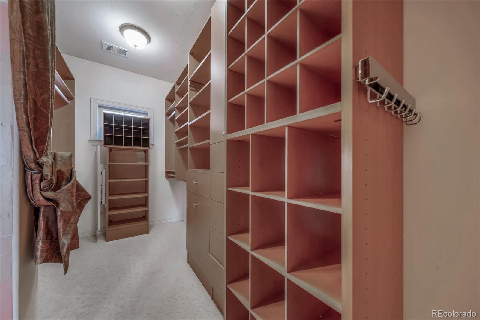 1425 South Elizabeth Street Denver, CO 80210 - Photo 31 of 50 a view of walk in closet with empty racks