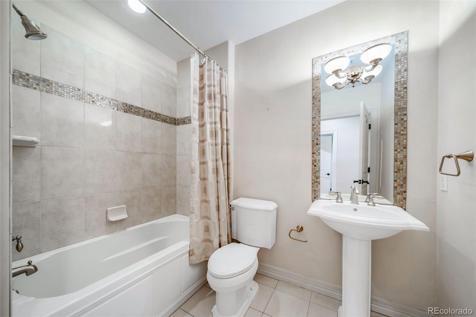 1425 South Elizabeth Street Denver, CO 80210 - Photo 39 of 50 a bathroom with a sink toilet tub and shower