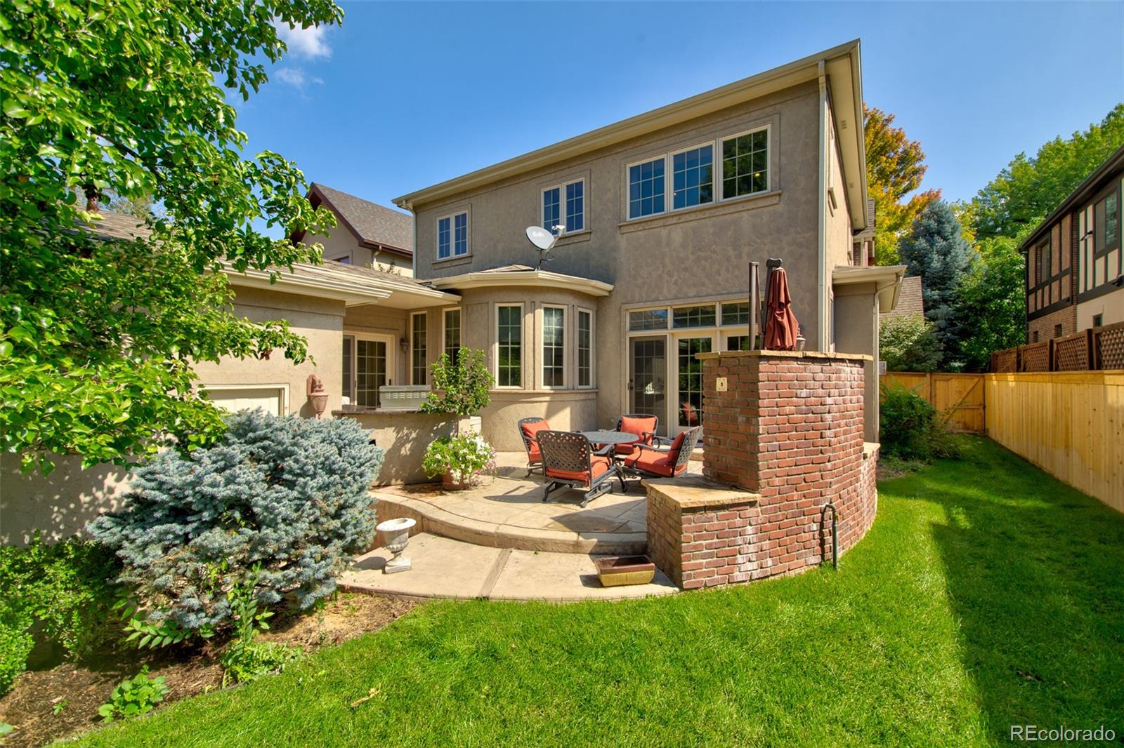 1425 South Elizabeth Street Denver, CO 80210 - Photo 44 of 50 front view of a house with a yard